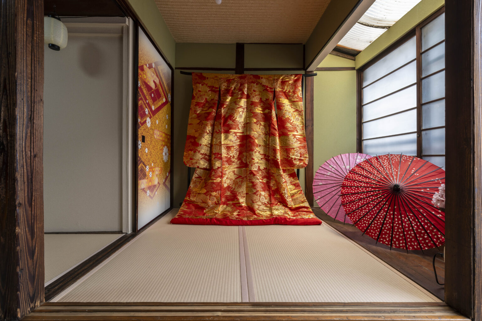 A traditional Japanese room adorned with beautiful kimonos