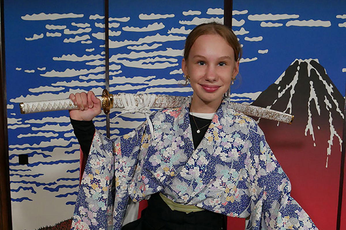 An Australian woman in a Samurai pose