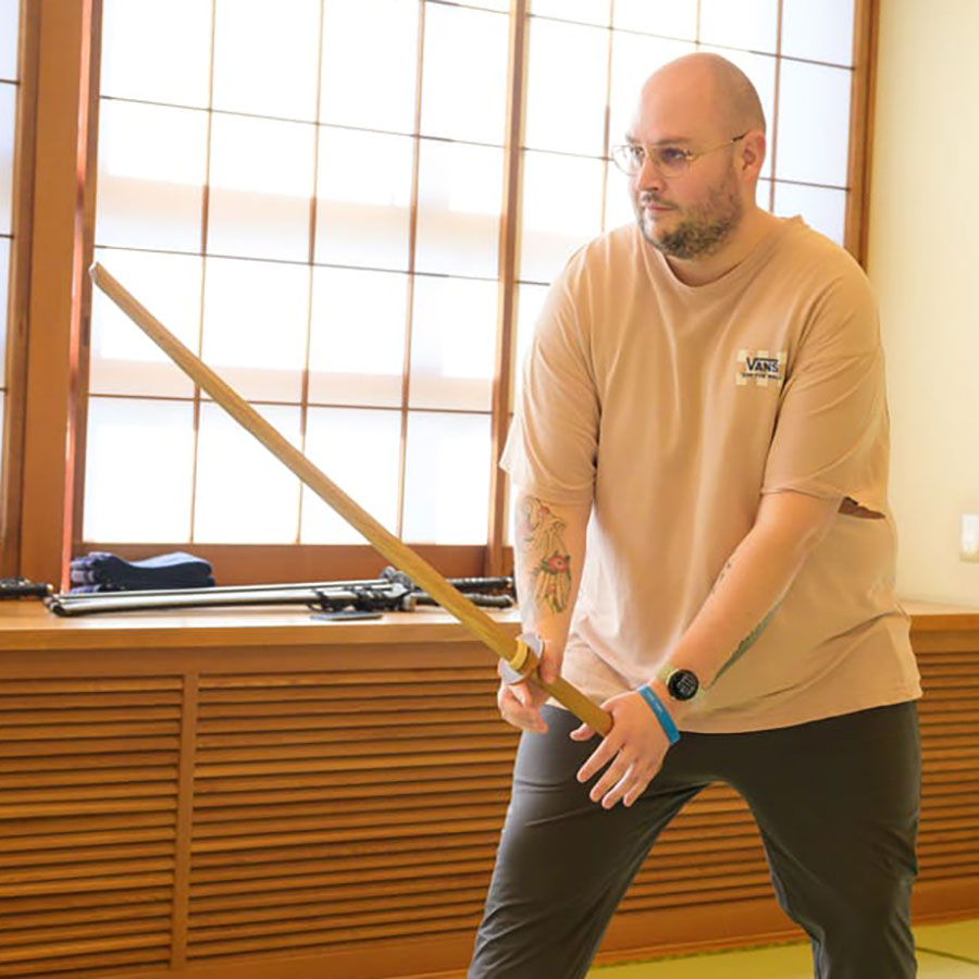 Traveler practicing Samurai sword techniques in the Ultimate Samurai Experience